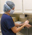 Dr. Kim Everson scrubs for surgery